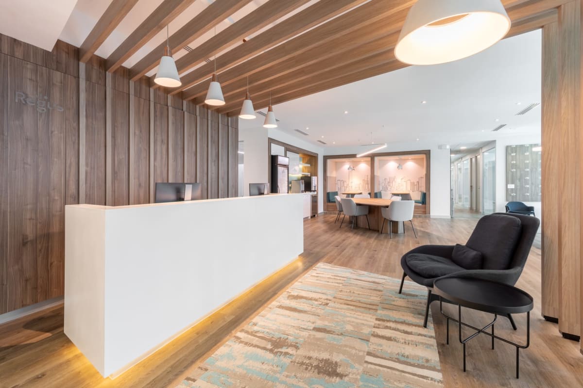 Open plan collaborative workspace with glass partitions Banistmo Tower