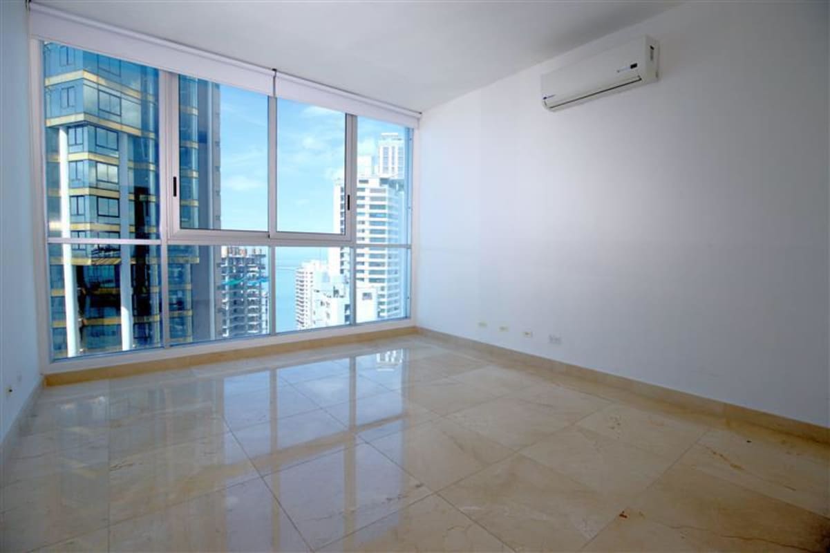 Modern bathroom with double sink, marble countertop, glass shower in PH Aventura Punta Paitilla Panama City