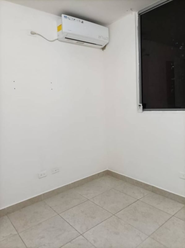 Bedroom with closet, window, and ceramic floors in PH Mystic Tower Rio Abajo Panama