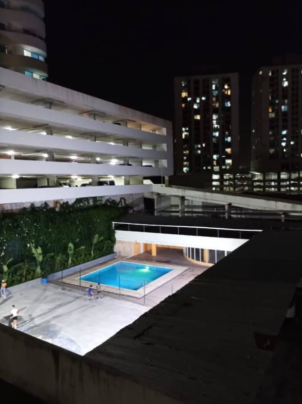 Night view of illuminated swimming pool in PH Mystic Tower Rio Abajo Panama City