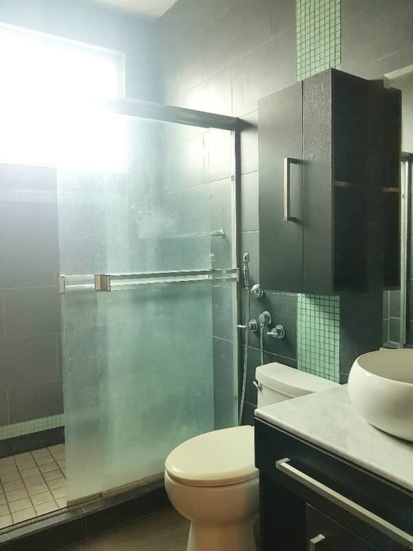 Apartment balcony overlooking Panama City skyline with safety net and glass railing in PH Emporium Tower