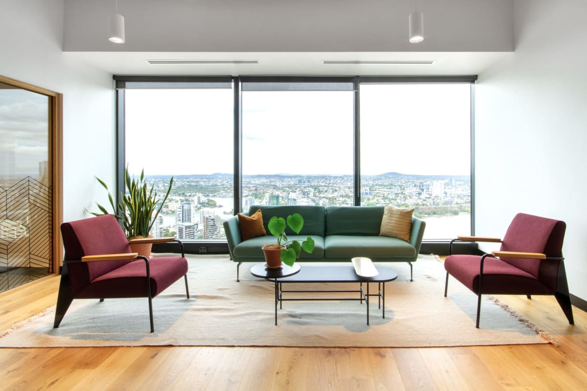 Modern meeting room with blue chairs flat screen and natural light in Plaza 2000 Panama