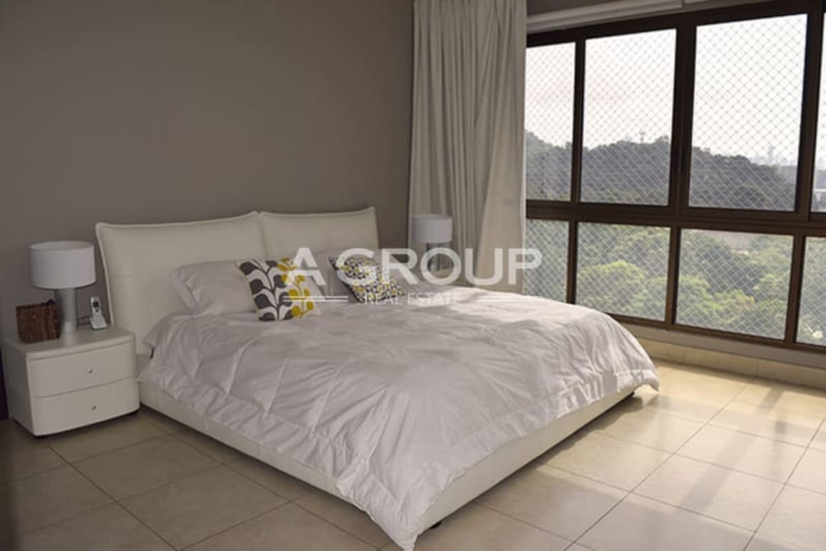 Elegant living room with floor-to-ceiling city and ocean views luxury apartment Amador Heights Panama City