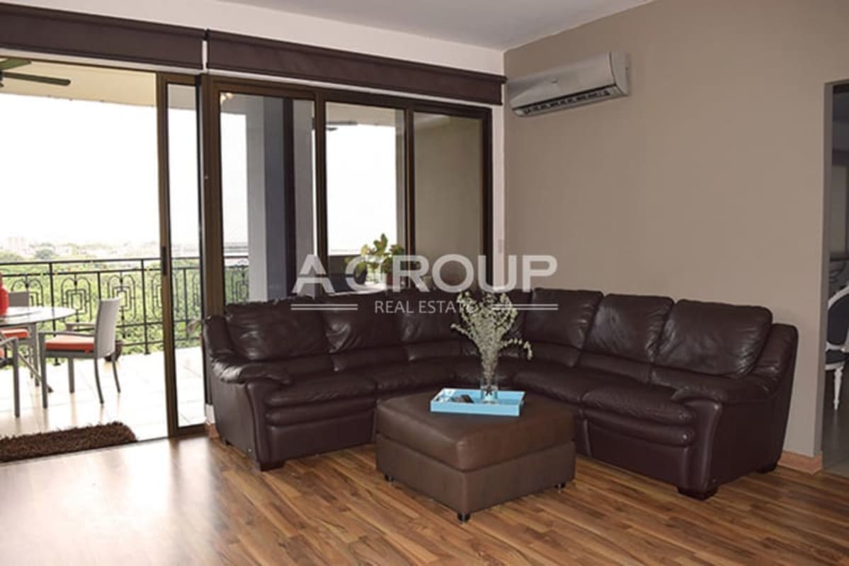 Elegant dining room with floor-to-ceiling corner windows luxury apartment Amador Heights Panama City