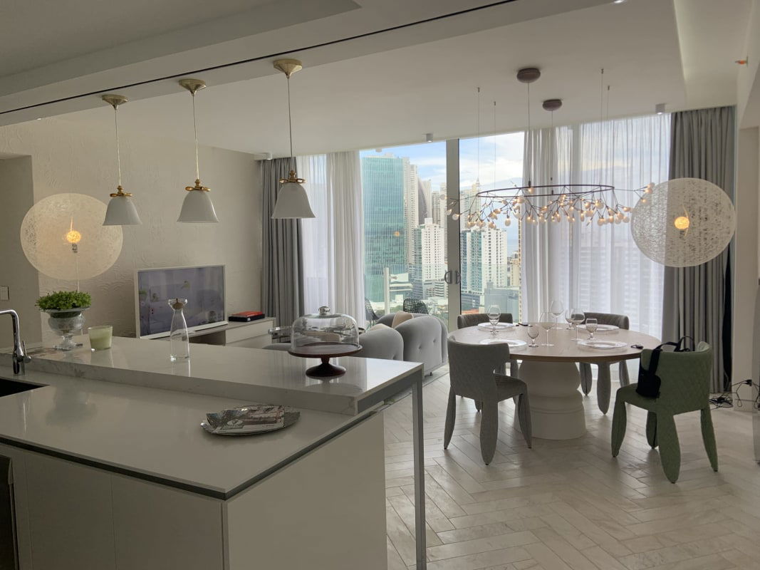 Bright open concept living and kitchen area with sleek finishes at Ocean Reef residence Panama City