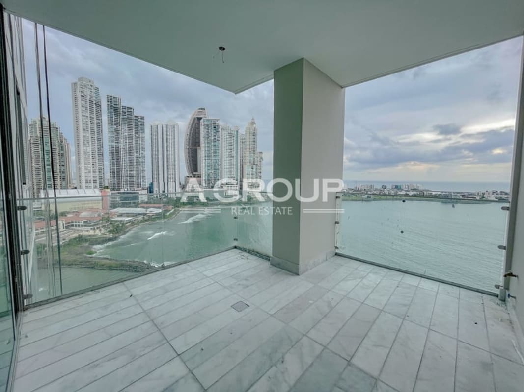 Modern panoramic balcony with glass railings overlooking the ocean at PH Sea Point Punta Paitilla Panama