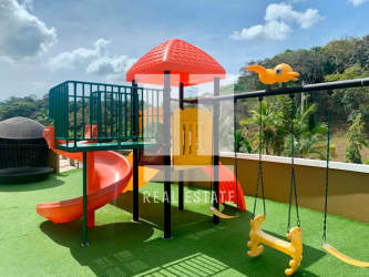 Rooftop children's playground slide swings play area PH Forest Tower Tucan Country Club Panama