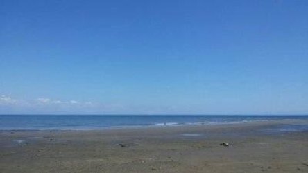 Calm waves on coastal beachfront land Panama near Costa Rica