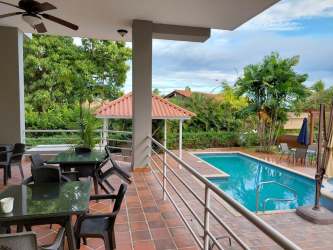 Bedroom with ocean view window and AC Playa Blanca Resort Panama apartment
