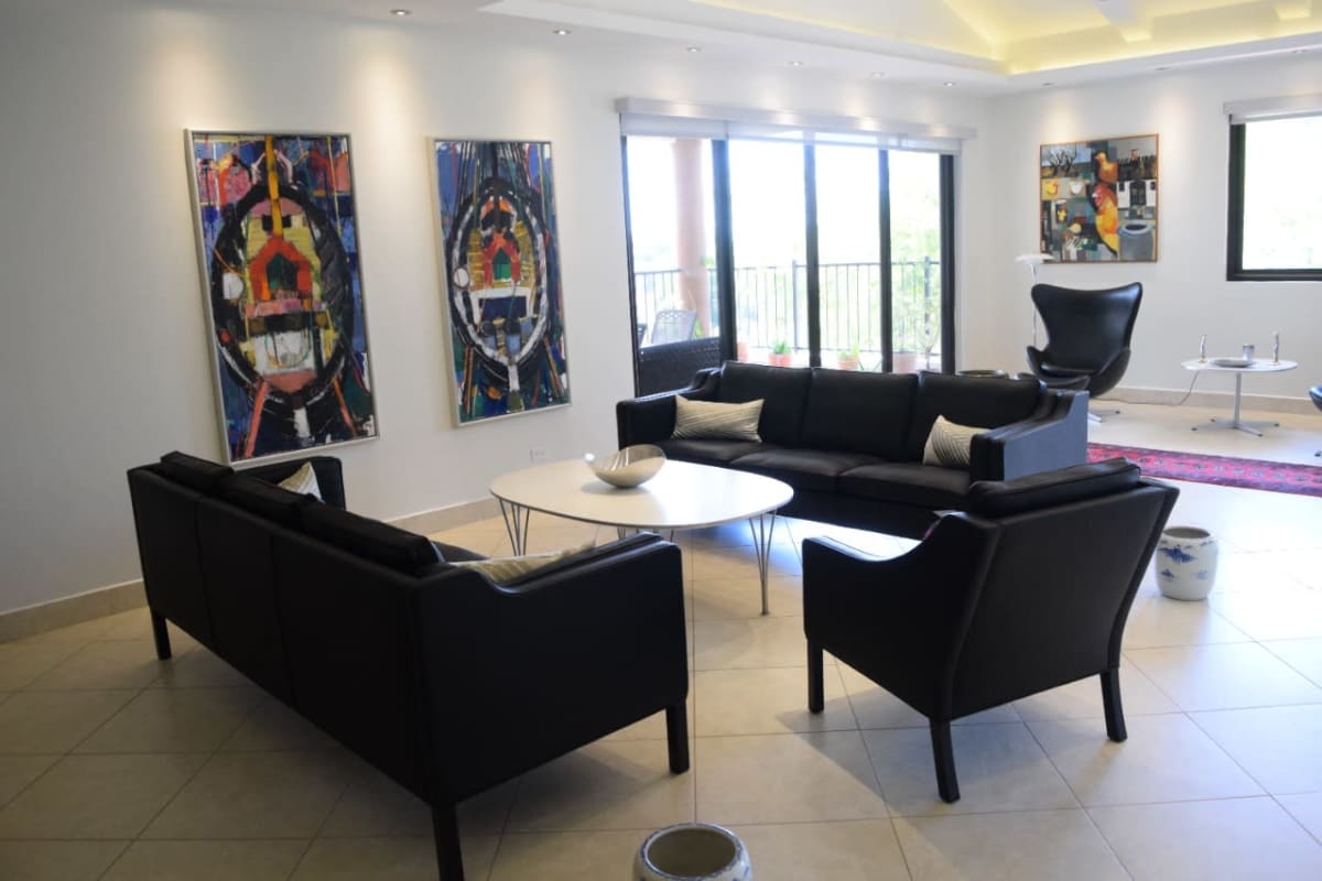 Modern German kitchen with marble counters and Miele appliances in Embassy Club Clayton