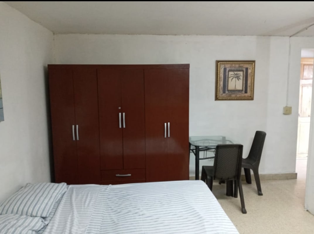 Bedroom with bed, wardrobe, dining table, minimalist design Dorado Panama