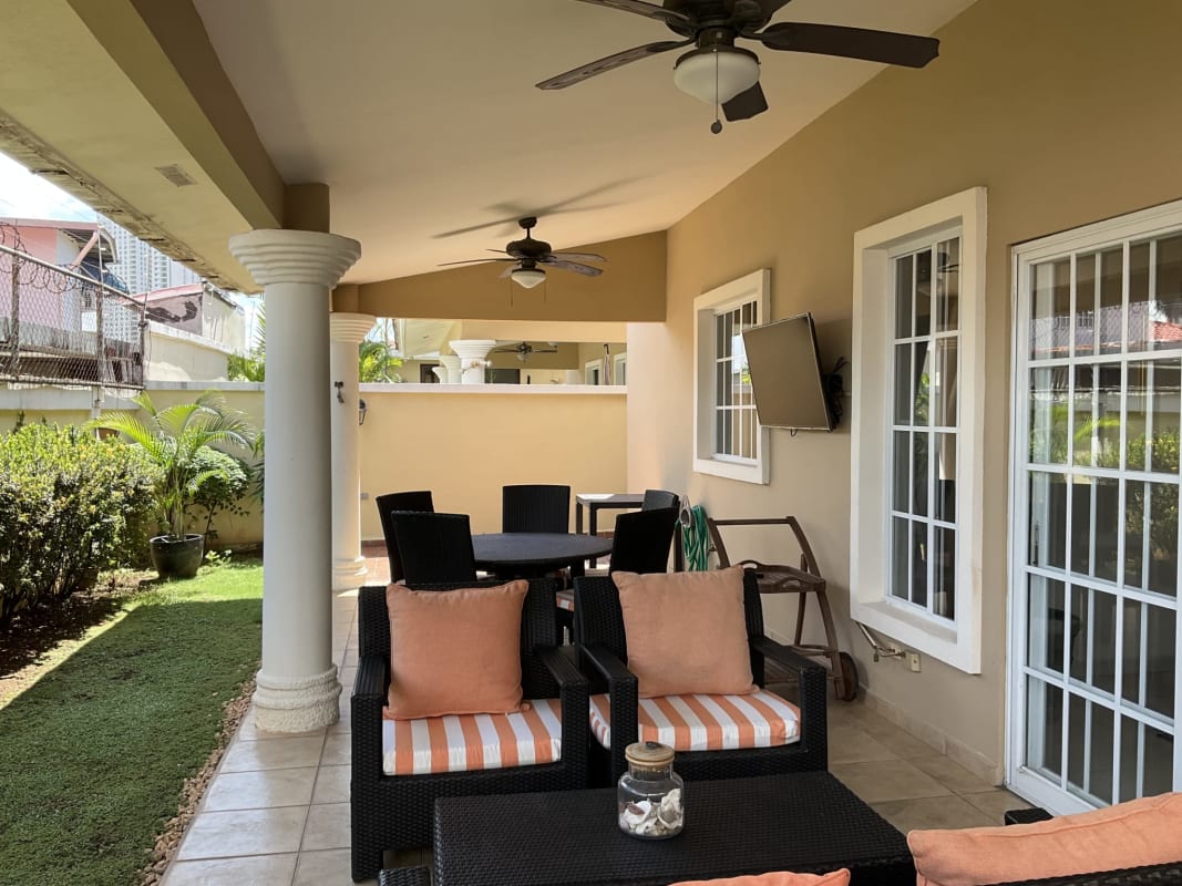 Covered terrace with outdoor lounge dining fan mounted TV Castel Novo home Panama