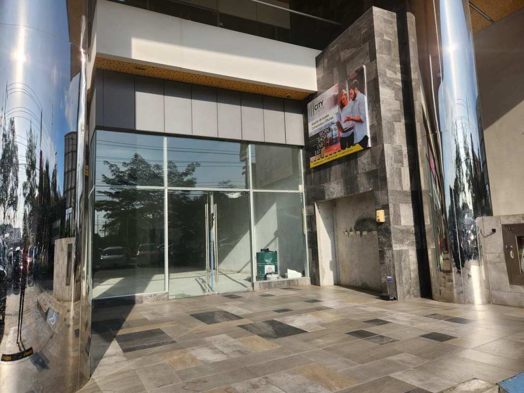 Glass storefronts reflective columns urban shopping center Dorado City Center Panama