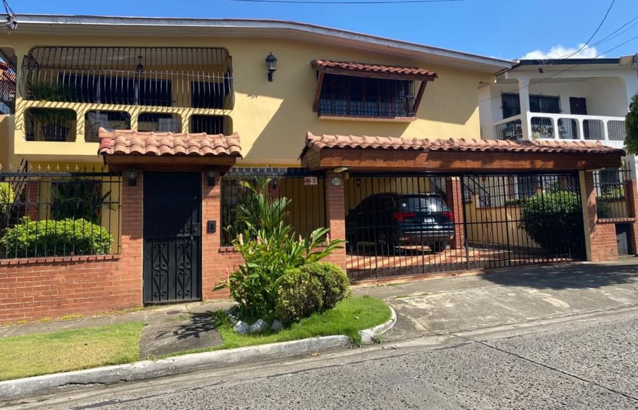 Two-story house with balcony, covered carport inside gated urbanization Altos del Dorado Panama City