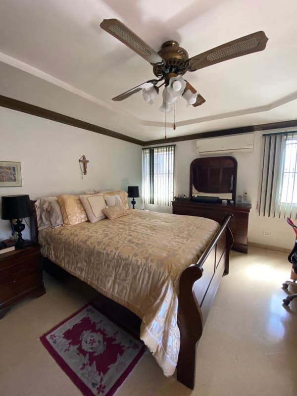 Full kitchen with mint green cabinets, stainless counters, gas stove in Bethania house for sale