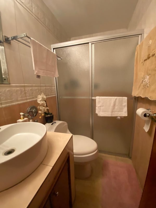 Bedroom with ceiling fan, AC, wood furniture in Altos del Dorado Bethania Panama house