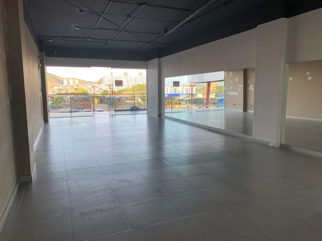 Spacious commercial open area with mirrors and large windows in PH Centennial Center Condado del Rey Panama