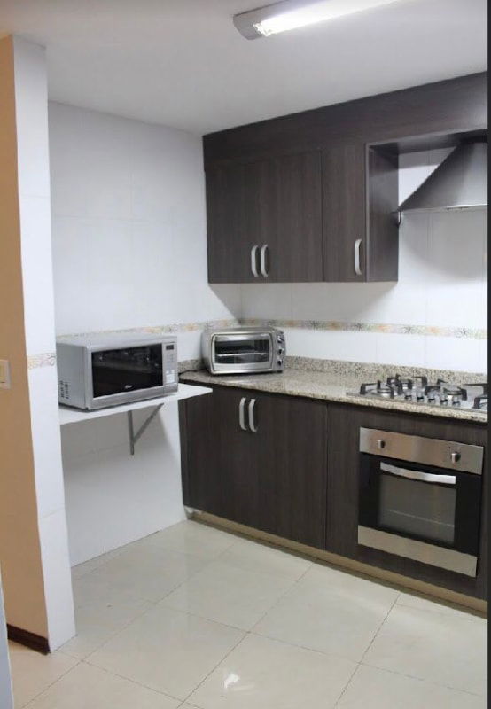 Contemporary dining area with modern pendant lighting and square table PH Royal Princess Paitilla Panama