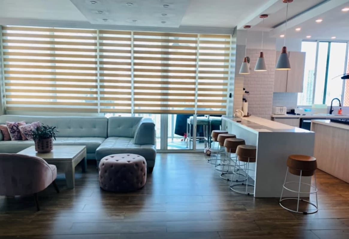 Spacious open-plan kitchen with granite island in luxury penthouse PH Mystic Point Panama City