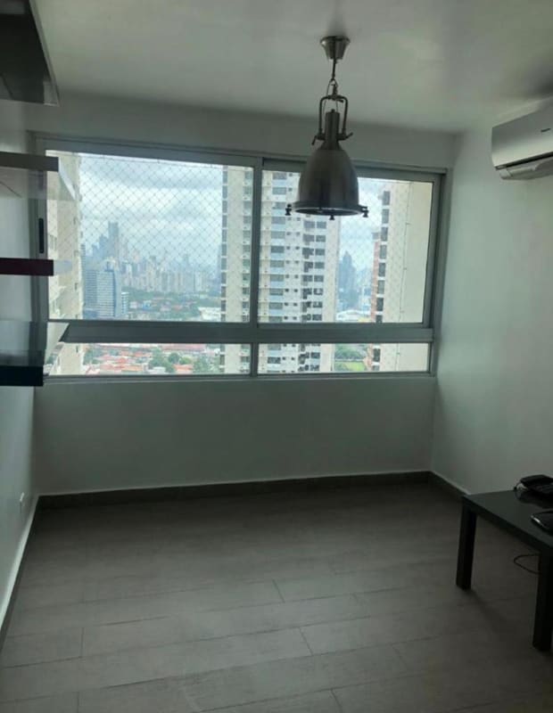 Minimalist living room with large windows, city view and modern decor furnished apartment rental Panama