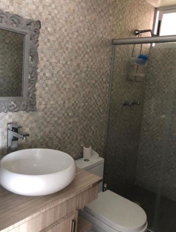 Master bath with bathtub mosaic tile vanity and mirror in PH San Francisco furnished rental