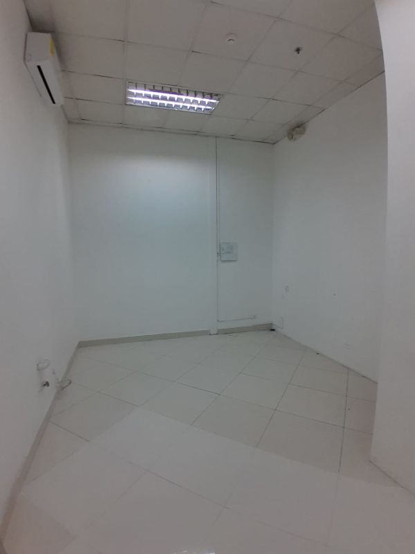Empty spacious warehouse or retail shop with tiled floors in Plaza Tocumen Panama City