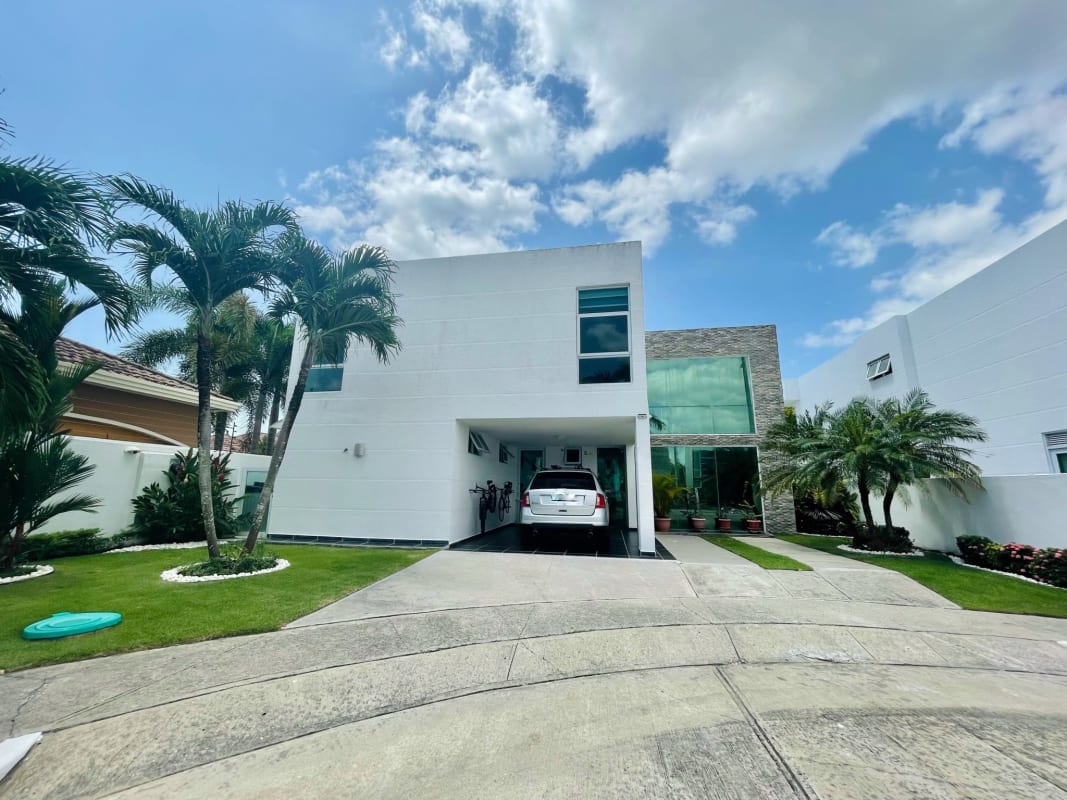 Modern living and dining room with double-height ceiling, marble floors in PH Costa Esmeralda Panama City
