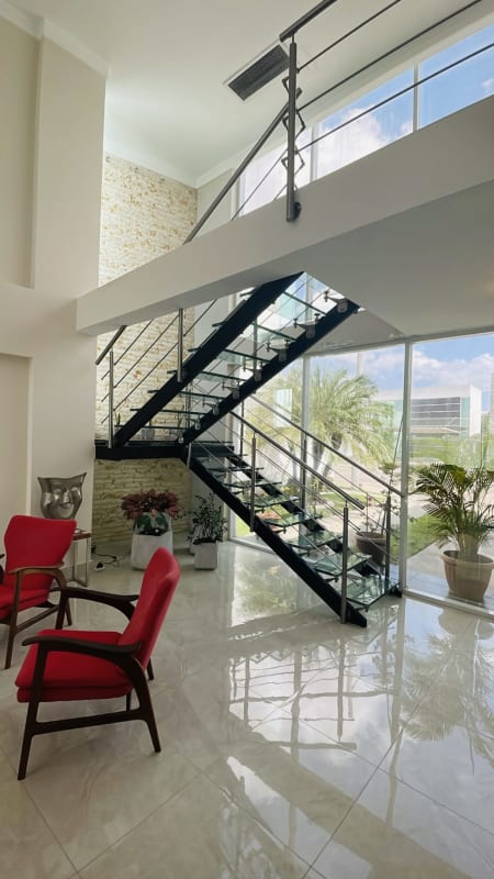 Spacious kitchen with modern cabinetry, granite counters, island bar in PH Costa Esmeralda Panama City