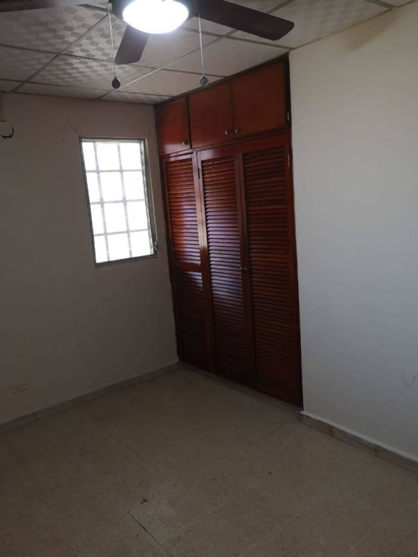 Bedroom with glass block window, ceiling fan and built-in closet Cerro Lindo Panama