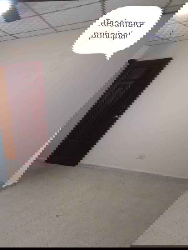 Master bedroom with beige walls, ceiling fan and ceramic tile floor, Cerro Lindo Panama