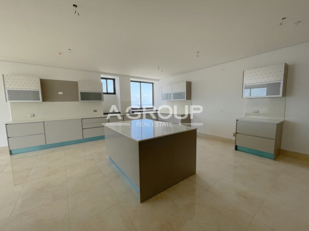 Luxury penthouse living room with floor-to-ceiling windows and Pacific Ocean views Costa del Este Panama