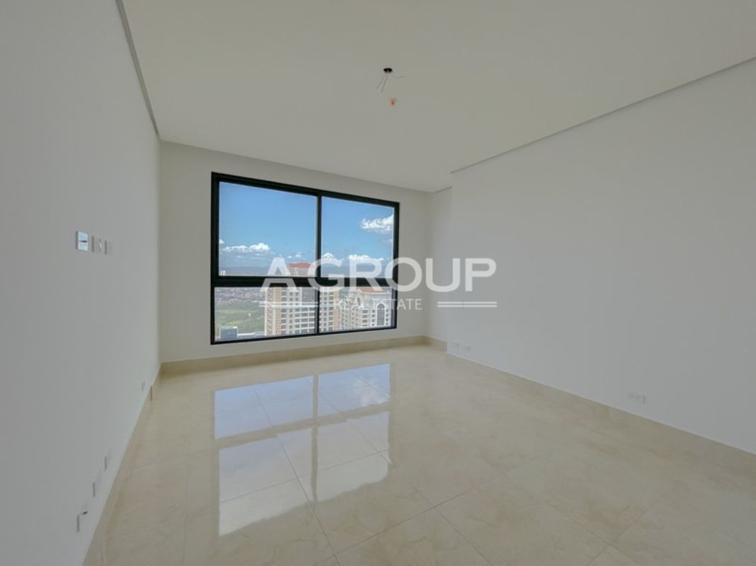 Master bedroom with floor-to-ceiling windows and Pacific ocean views in PH Matisse Costa del Este Panama