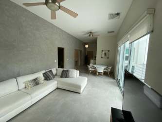 Spacious kitchen with granite counters and modern cabinets at Bijao condo Panama