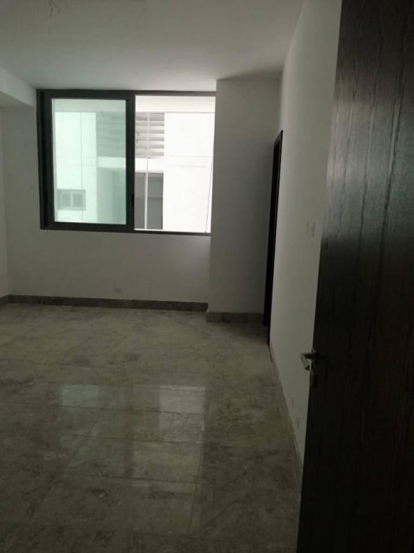 Bright spacious bedroom with marble floors, large window overlooking ocean at PH Sea Point Punta Paitilla Panama