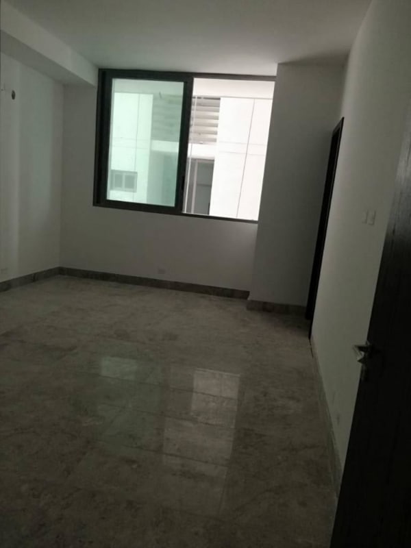 Large empty bedroom with marble floors and big window in PH Sea Point Paitilla Panama