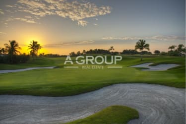 Green fairways and palm-lined bunkers at tropical golf resort Vista Mar Panama
