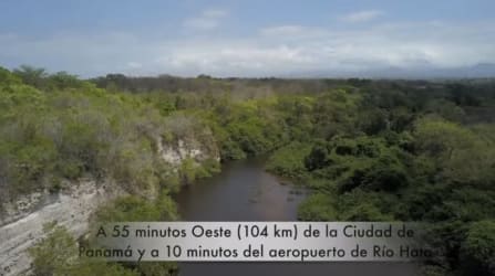 Aerial view of river and lush forest inside large titled land parcel near Pacific coast in Coclé Panama