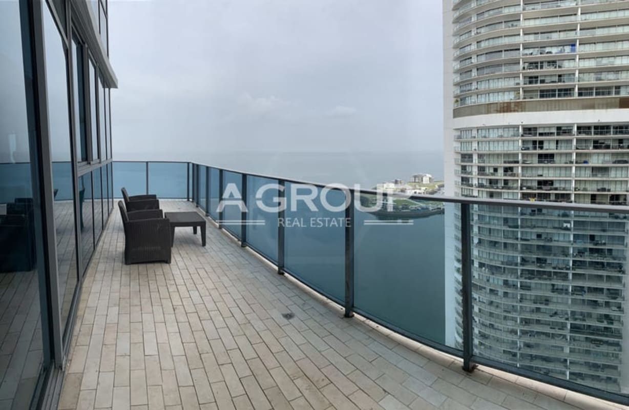 Luxury balcony with glass railing offering Pacific Ocean views at PH Grand Tower Panama
