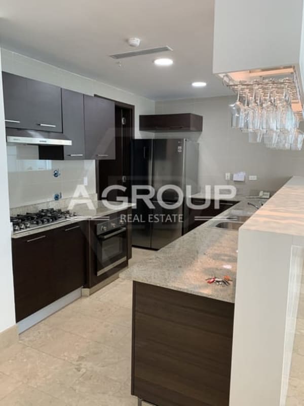 Spacious living dining area with marble floors and large windows with ocean views Grand Tower Punta Pacífica