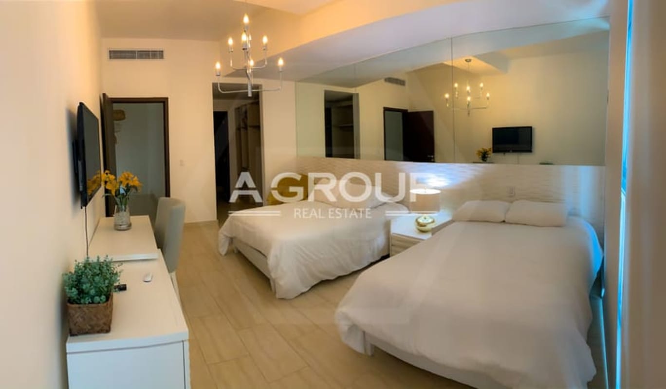 Elegant dining room space with contemporary lighting fixtures Grand Tower Punta Pacífica Panama