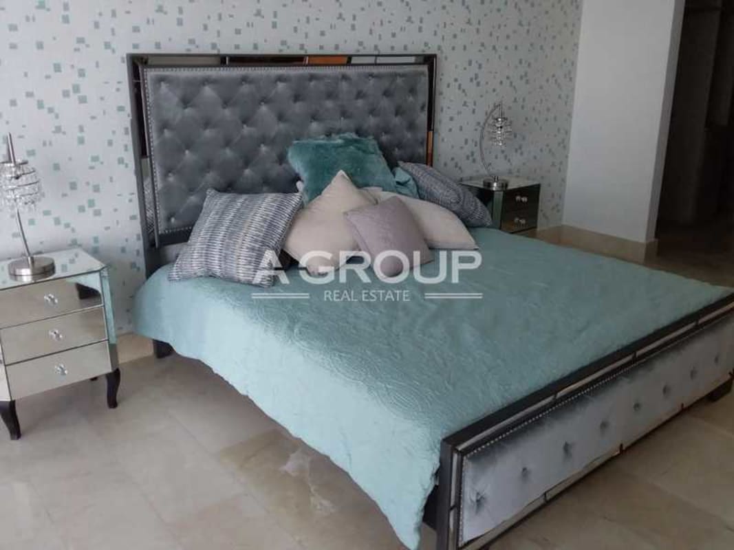 Bedroom with tufted headboard and upscale decor in PH Grand Tower Punta Pacifica Panama