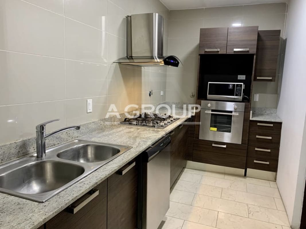 Modern bathroom featuring double sink vanity, glass shower and bathtub at Grand Tower luxury condo Panama City