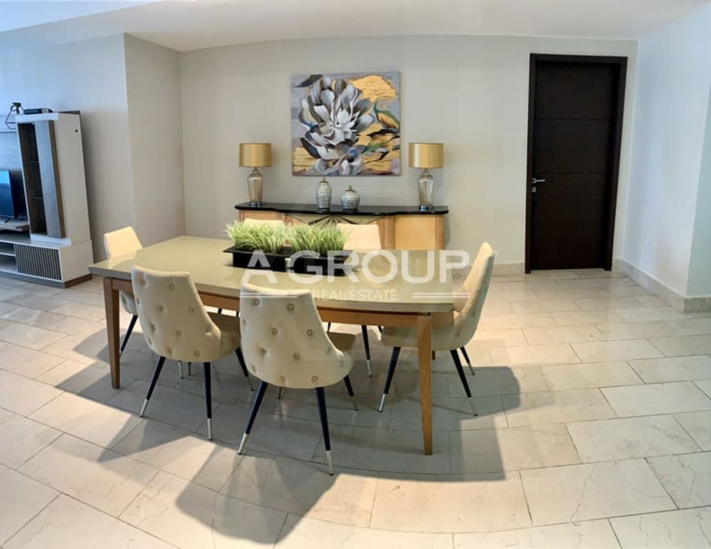 Spacious master bedroom featuring balcony with city and ocean views at Grand Tower Punta Pacifica Panama