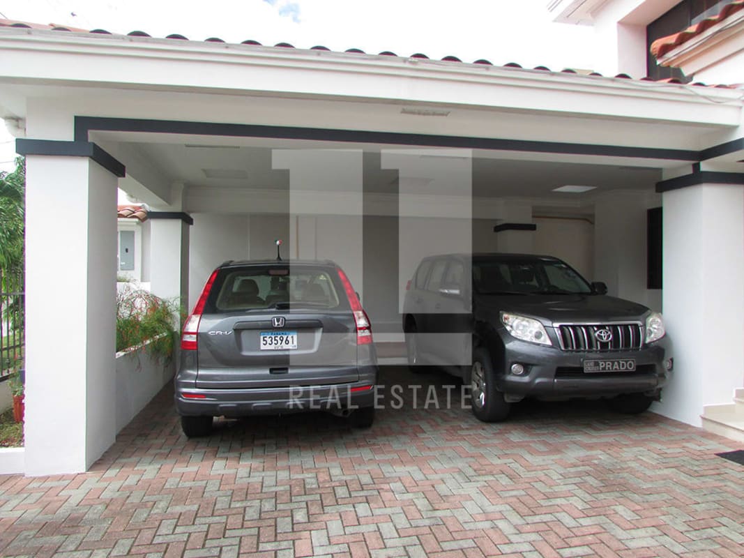 Luxury Mediterranean two-story house with large covered patio and tiled roof in Altos de Panamá Panama