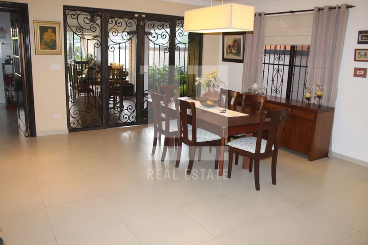 Spacious modern living room with large windows in luxury house Altos de Panamá Panama