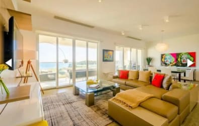 Living and dining with floor-to-ceiling windows and ocean view Casamar Marinazul 2 San Carlos Panama