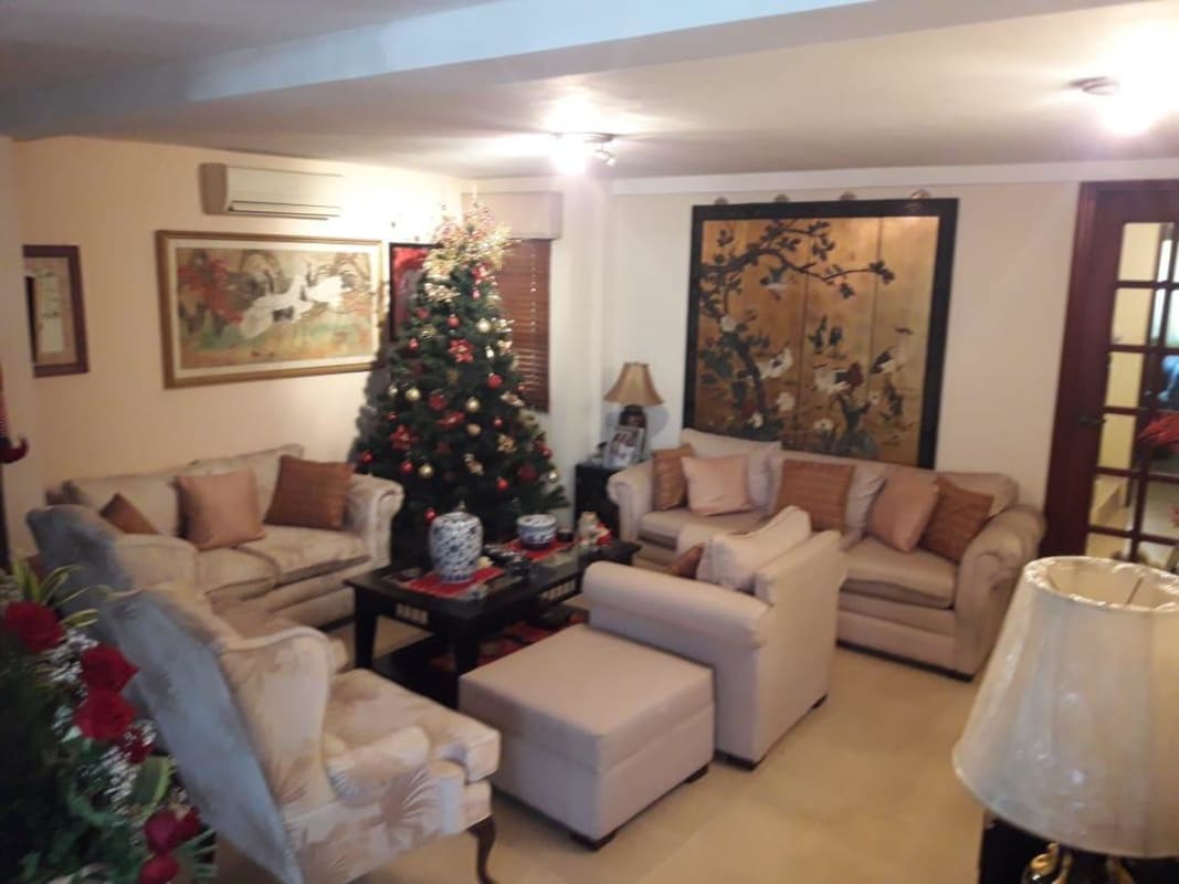 Traditional style living room with beige sofas, decorations, Christmas tree, La Loma Panama