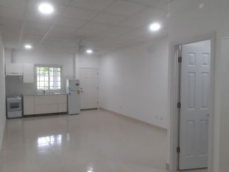 White minimalist bathroom walk-in shower pedestal sink in PH Rincon del Paraiso Rio Hato Panama
