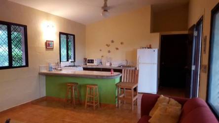Covered outdoor terrace with lounge chairs at Coronado Panama beach villa
