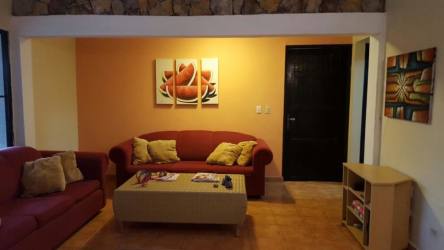 Covered outdoor BBQ area with greenery Coronado beach house Panama